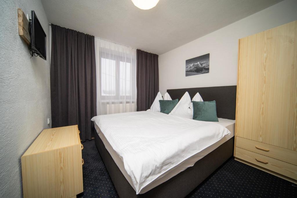 A bed or beds in a room at Ubytovanie u Maťka a Kubka