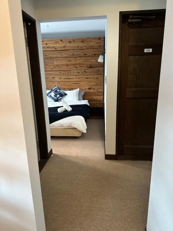 Postel nebo postele na pokoji v ubytování Legend Inn Myoko