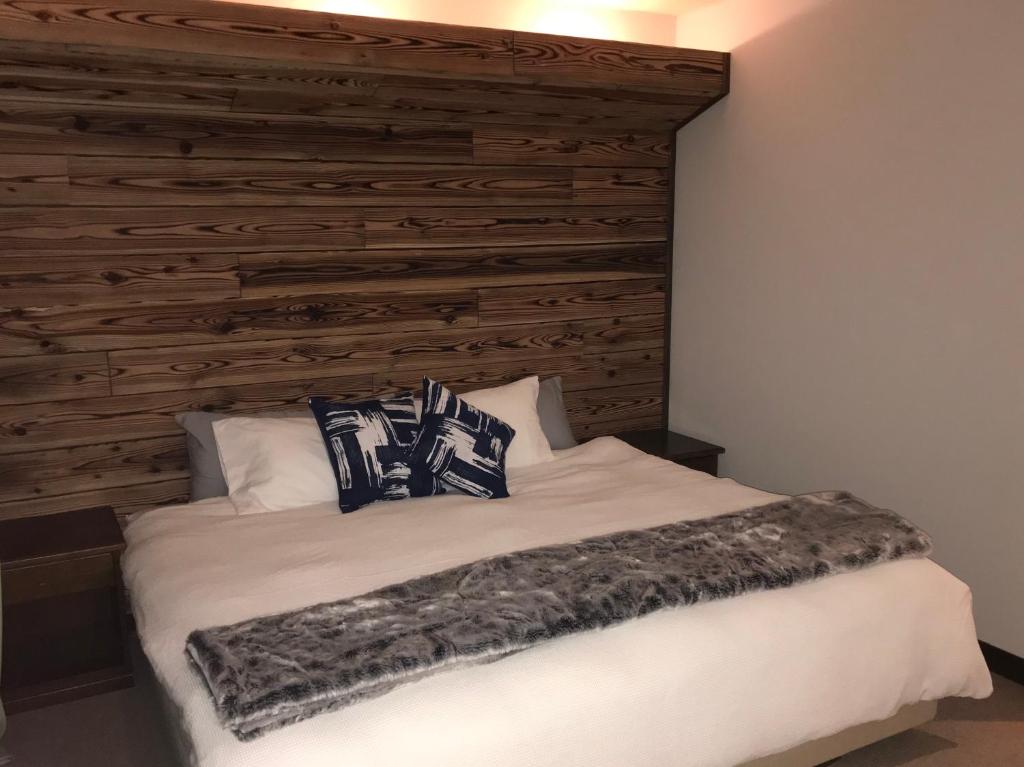 Postel nebo postele na pokoji v ubytování Legend Inn Myoko