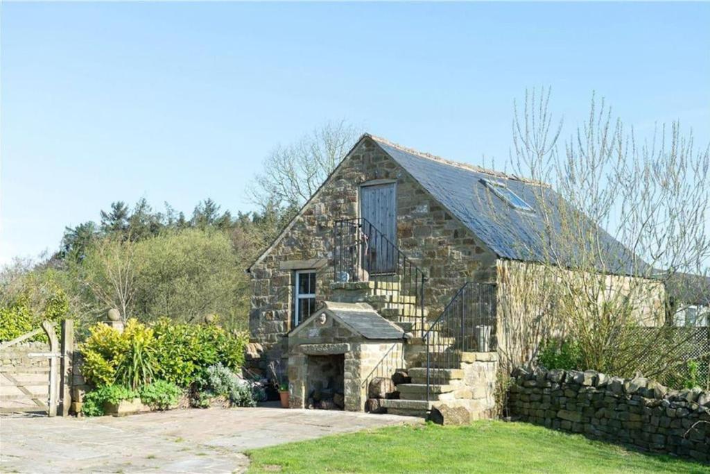 an old stone barn with a stone staircase in front at Charming 2-Bed Cottage in Otley in Otley