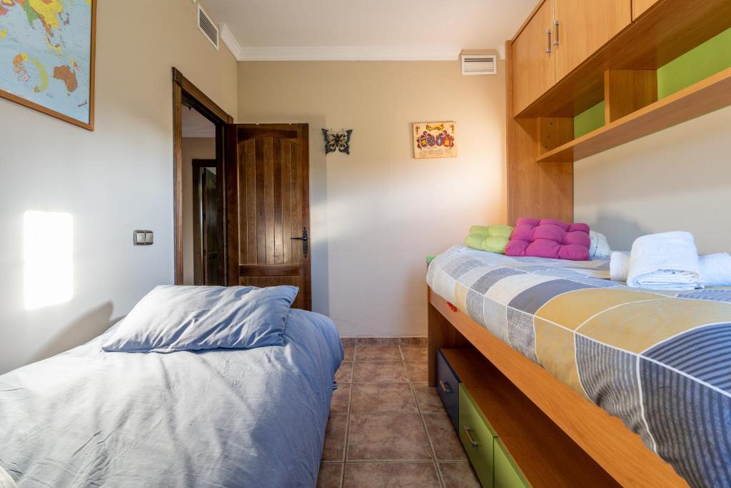 Posteľ alebo postele v izbe v ubytovaní Hacienda La Carreta