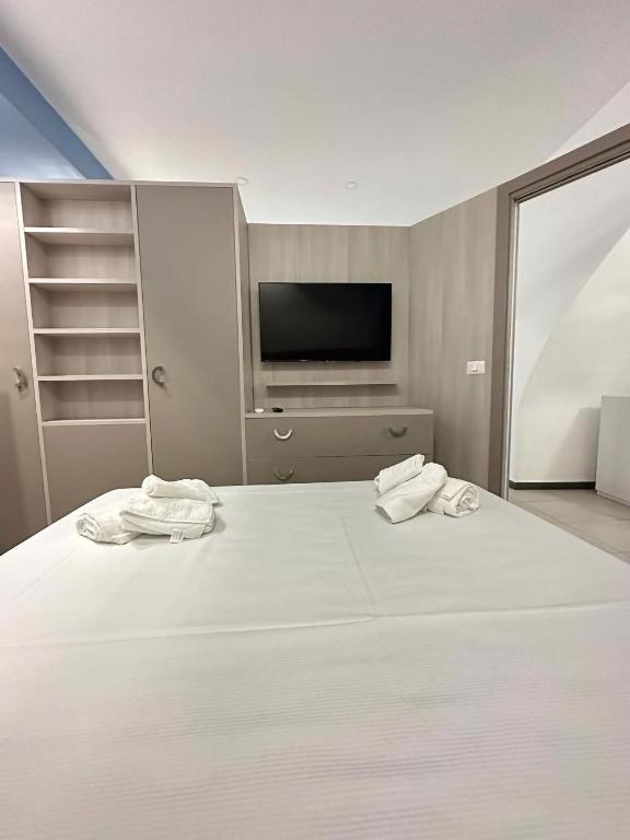 A bed or beds in a room at Notti Magiche