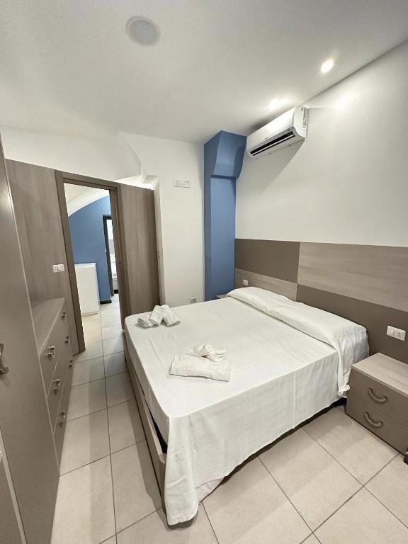 A bed or beds in a room at Notti Magiche