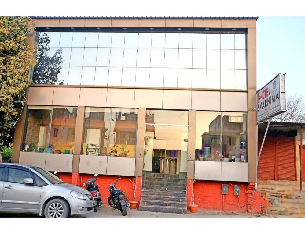 a car parked in front of a store at Hotel Svarnima The Heritage,Chitrakoot in Sītāpur Mūāfi