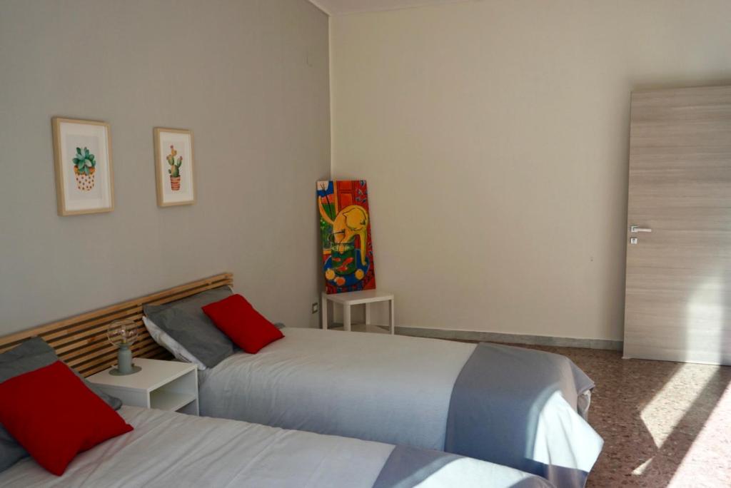 Łóżko lub łóżka w pokoju w obiekcie Sosta d'Oltremare