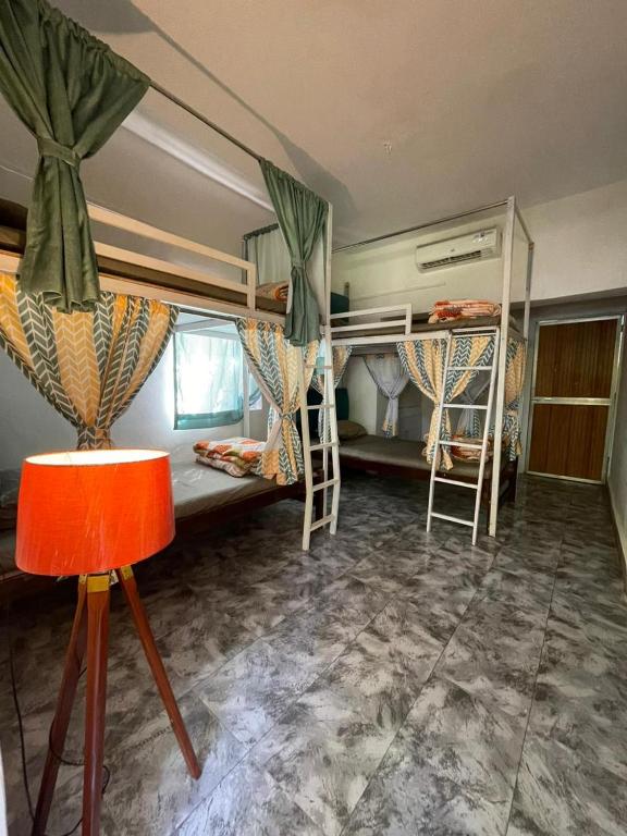 Postel nebo postele na pokoji v ubytování Kaabo Hostel
