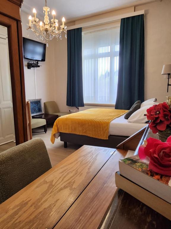 Postel nebo postele na pokoji v ubytování Hotel Gulden Vlies