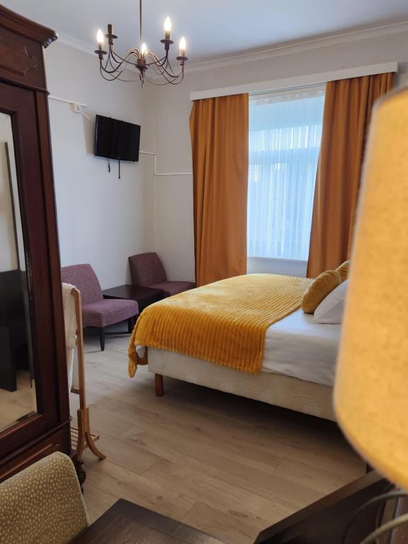 Postel nebo postele na pokoji v ubytování Hotel Gulden Vlies