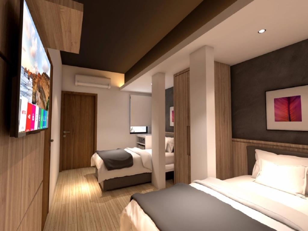 Postel nebo postele na pokoji v ubytování Grand Hallmark Hotel - Johor Bahru