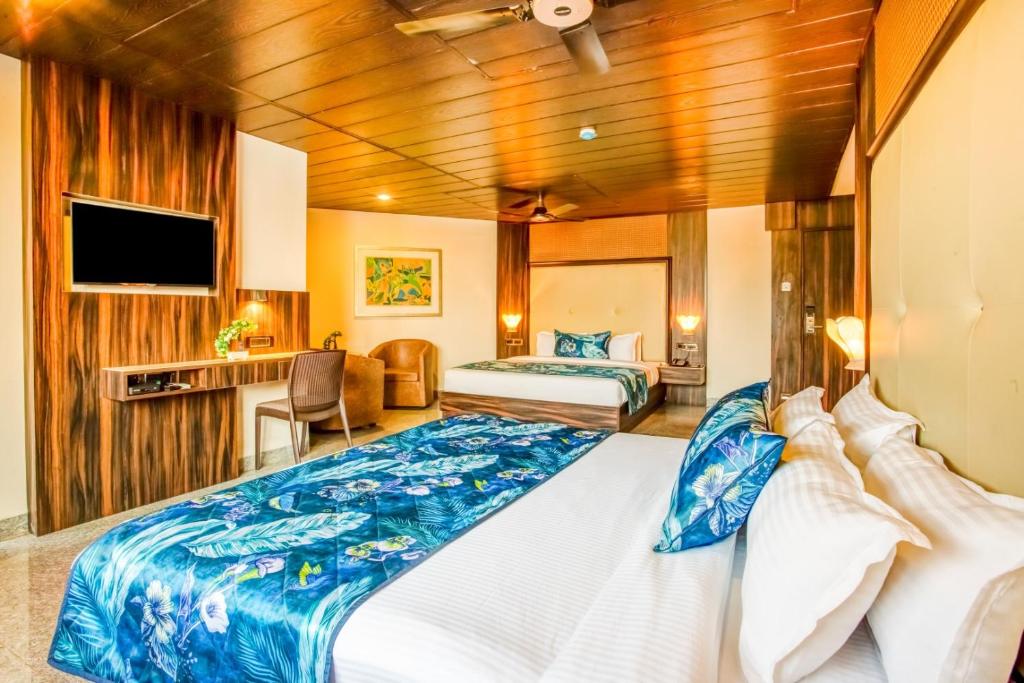 Postel nebo postele na pokoji v ubytování Summit Calangute Resort & Spa