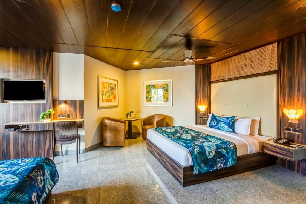 Postel nebo postele na pokoji v ubytování Summit Calangute Resort & Spa