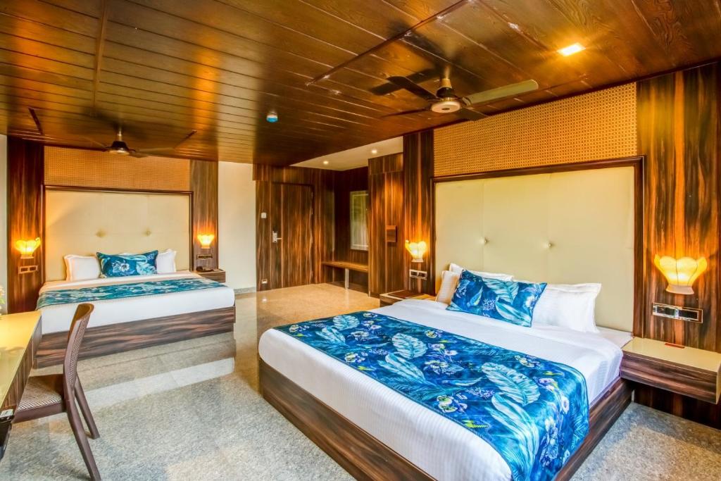 Postel nebo postele na pokoji v ubytování Summit Calangute Resort & Spa