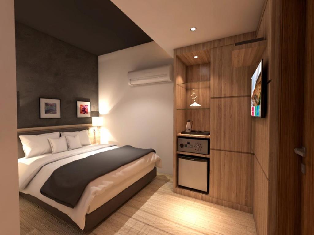 Postel nebo postele na pokoji v ubytování Grand Hallmark Hotel - Johor Bahru
