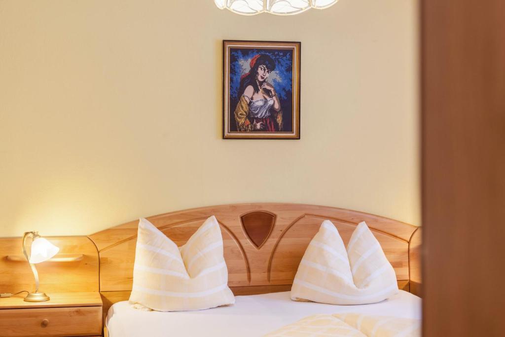 Postel nebo postele na pokoji v ubytování Gästehaus Gisela 2