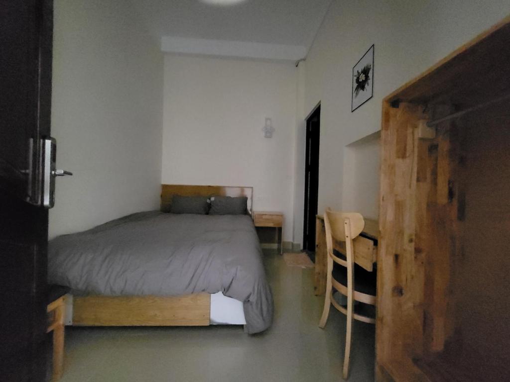 Postel nebo postele na pokoji v ubytování K Bình Phương Hotel