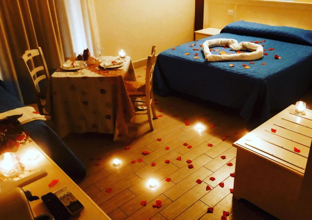 Postel nebo postele na pokoji v ubytování Hotel Al Rustico