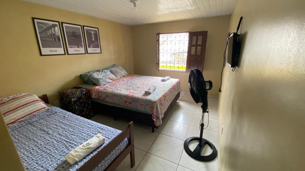 Postel nebo postele na pokoji v ubytování RioSlz Hostel