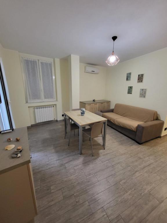 a living room with a couch and a table at Puppo Apartments in Corniglia