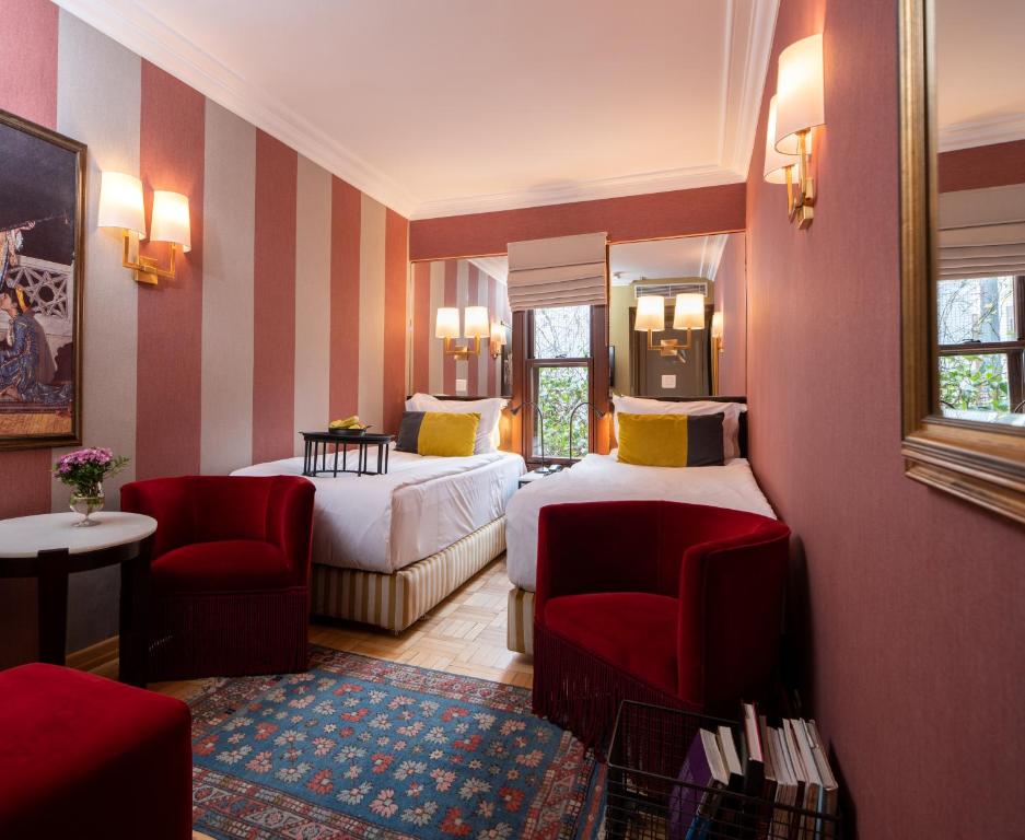 Postel nebo postele na pokoji v ubytování Hotel Ibrahim Pasha