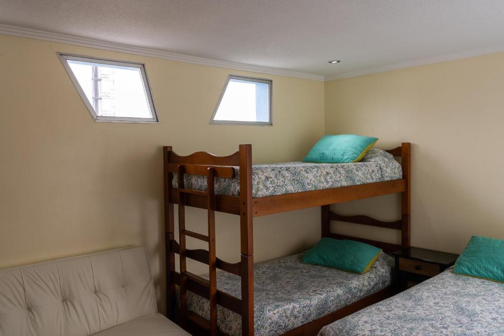 Postel nebo postele na pokoji v ubytování Apart Hotel Colors
