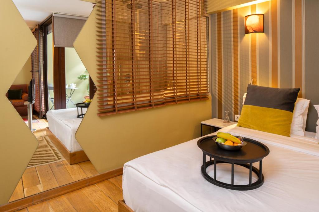 Postel nebo postele na pokoji v ubytování Hotel Ibrahim Pasha
