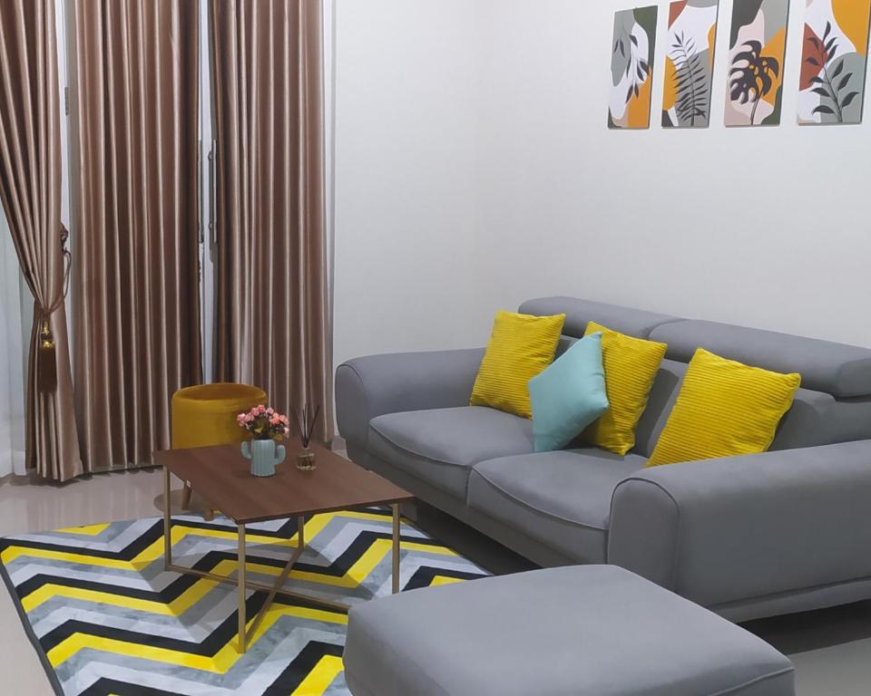 a living room with a couch and a table at Villa Kayana EE6 - 3 Bedrooms in Batu