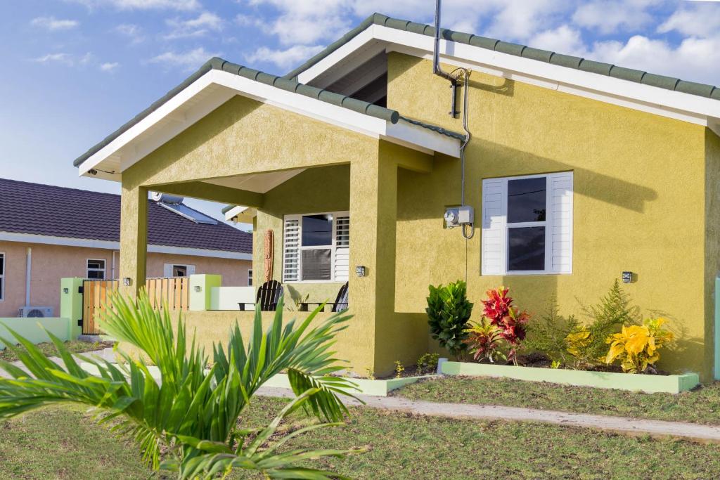 a house with a yellow at Ocho Rios Casa Princess Vacay Villa in Ocho Rios