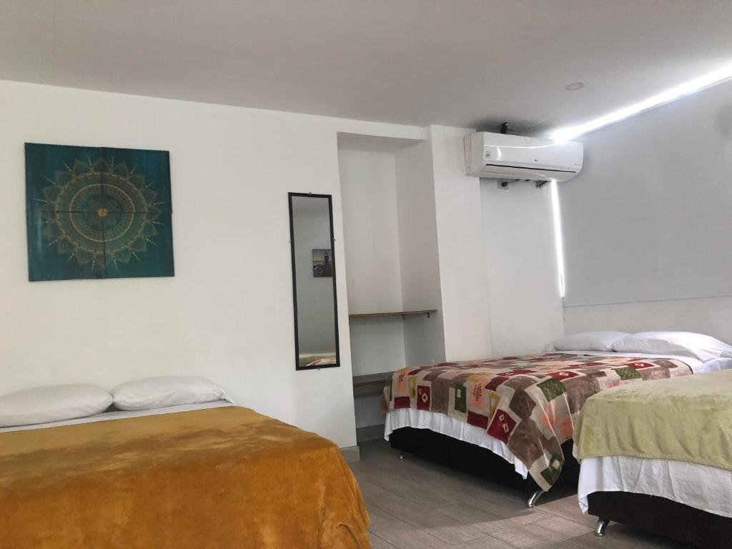Postel nebo postele na pokoji v ubytování Casona La Carolina