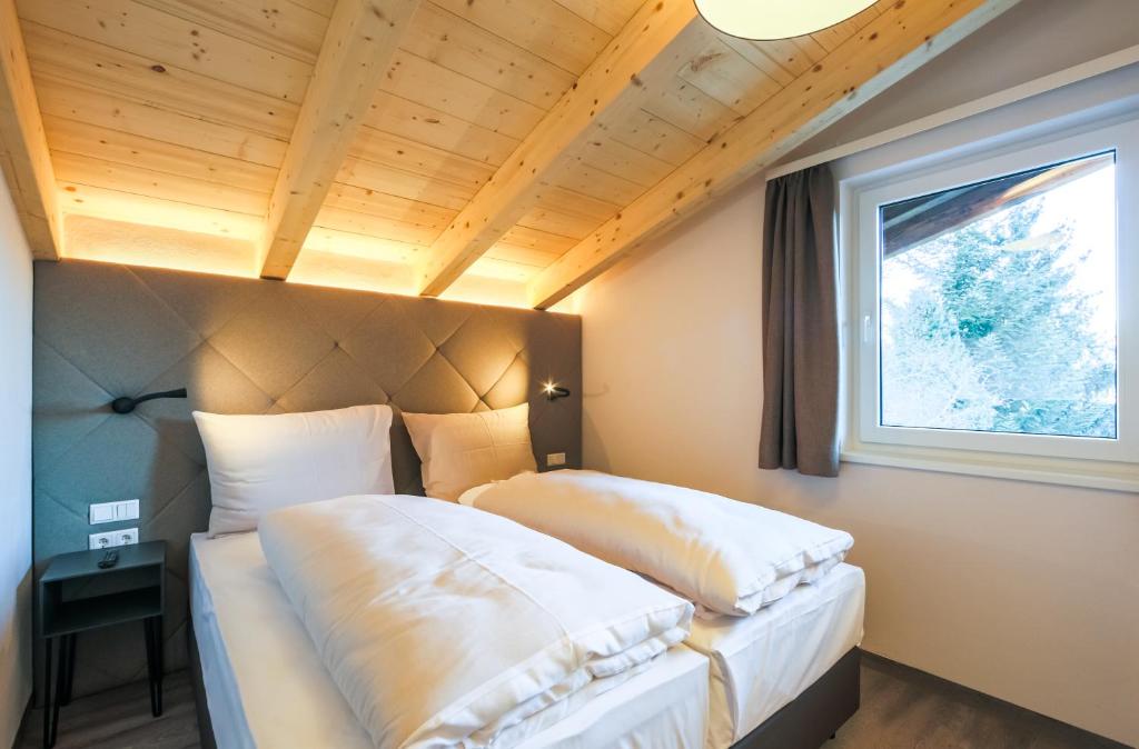 Postel nebo postele na pokoji v ubytování AvenidA Panorama Suites