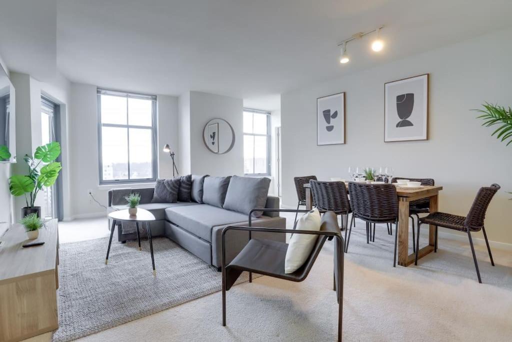 a living room with a couch and a table at Fantastic 2 BR Condo At Pentagon City With Gym in Arlington