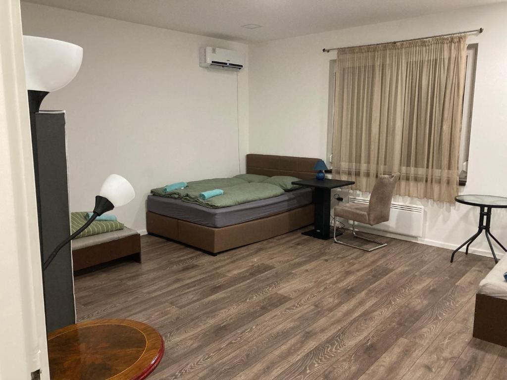 Posteľ alebo postele v izbe v ubytovaní Roland Apartment Zuglo 2