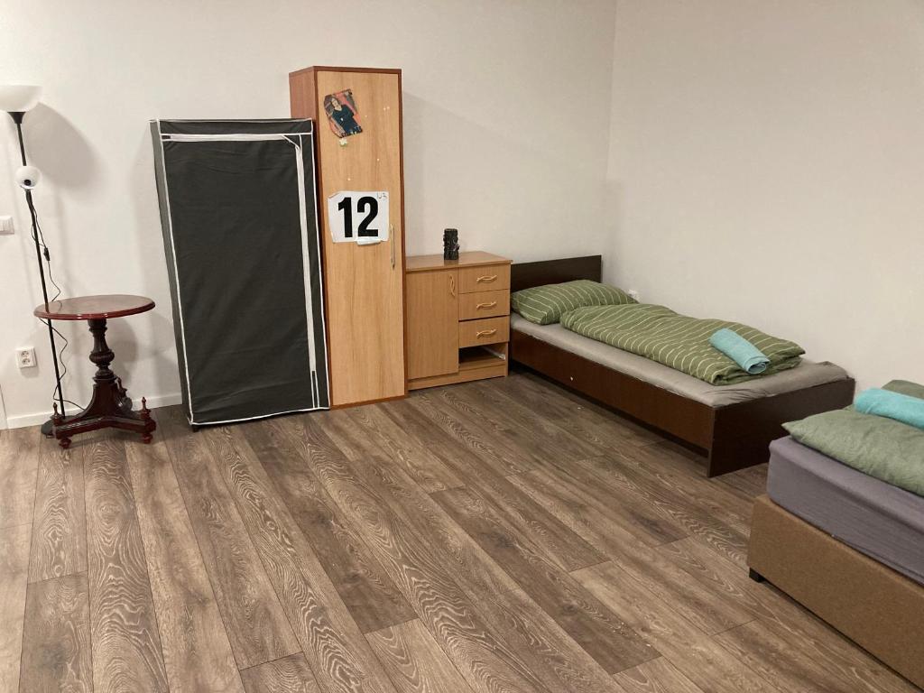 Posteľ alebo postele v izbe v ubytovaní Roland Apartment Zuglo 2
