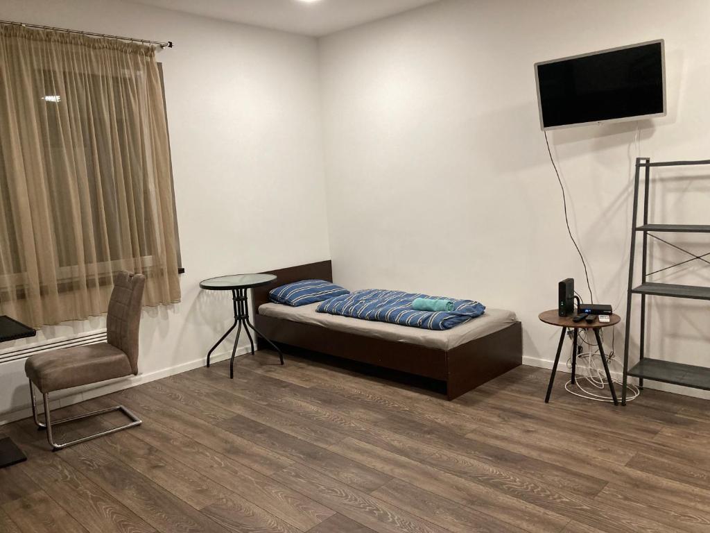 Posteľ alebo postele v izbe v ubytovaní Roland Apartment Zuglo 2