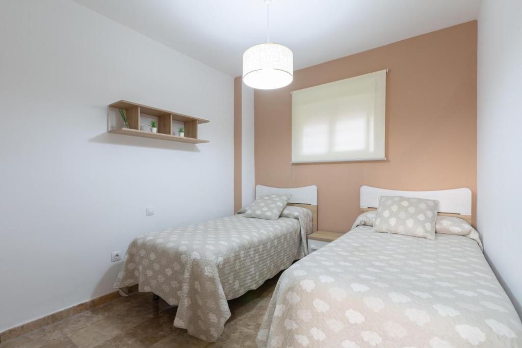 Postel nebo postele na pokoji v ubytování Casa Carmen