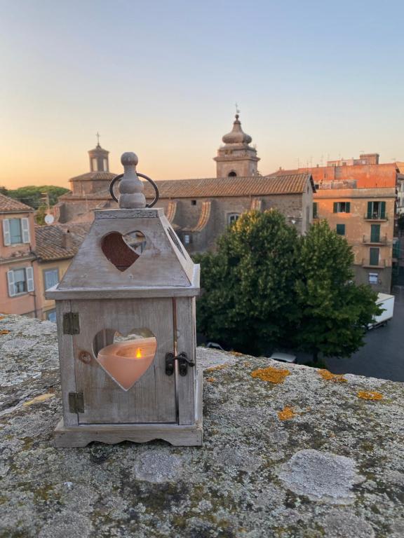 a birdhouse with a heart painted on it on a building at SanFa Roof in Viterbo