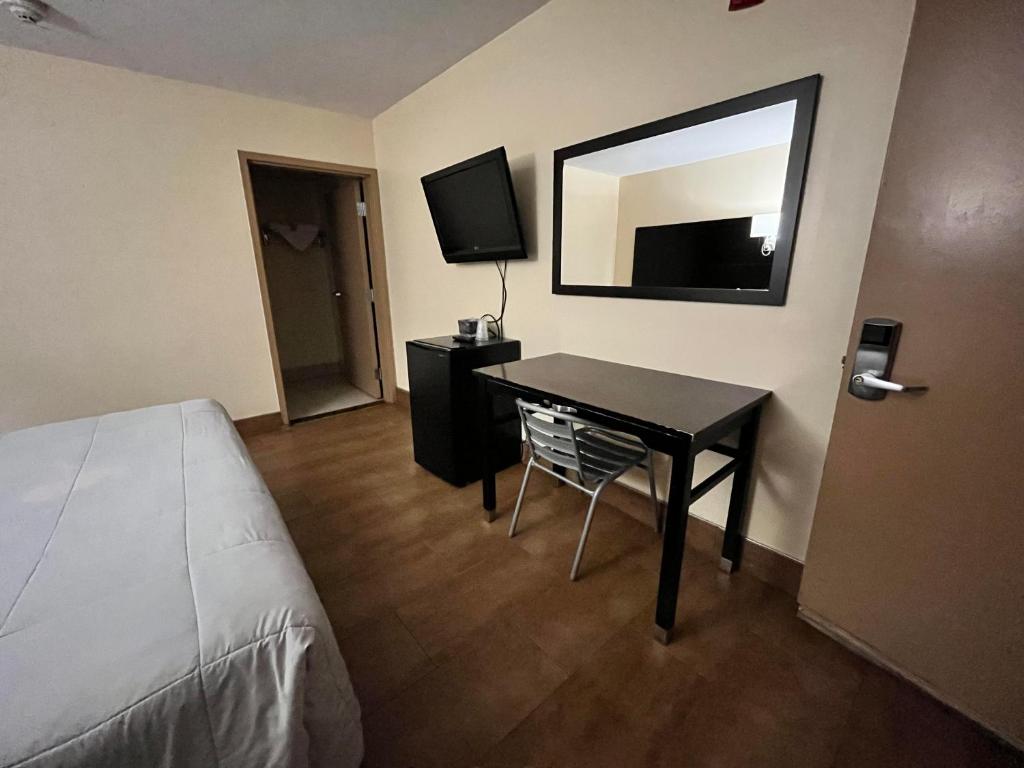 TV a/nebo společenská místnost v ubytování Circle Motor Lodge