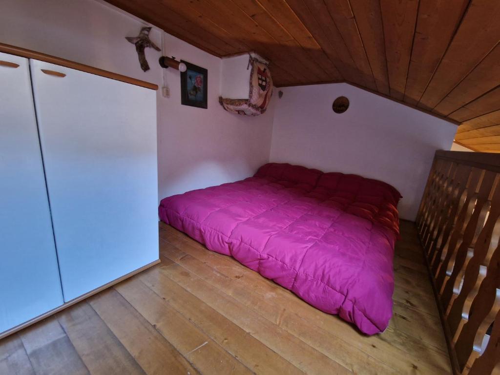 Postel nebo postele na pokoji v ubytování Appartamento Latemar Predazzo