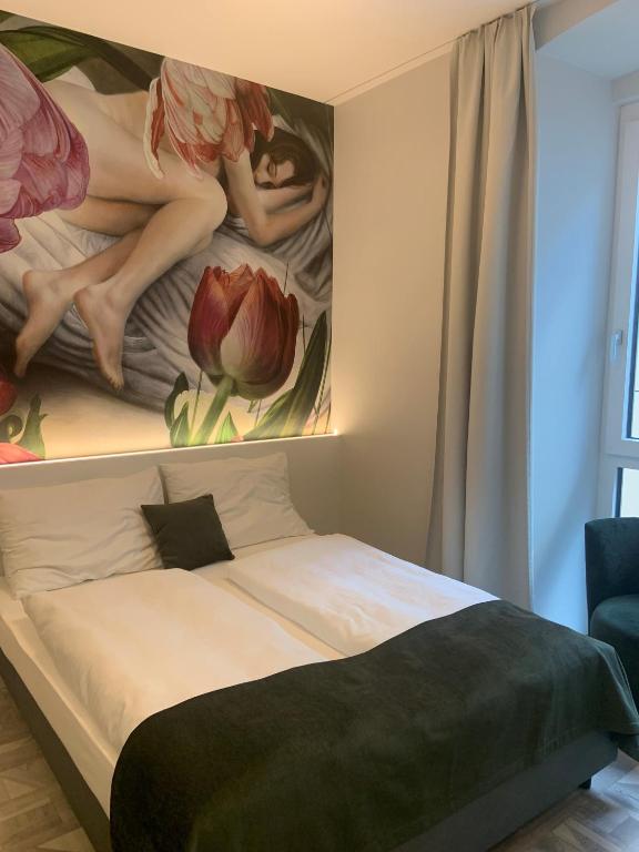 Ένα ή περισσότερα κρεβάτια σε δωμάτιο στο ART-INN Design Self-Check-in-Hotel