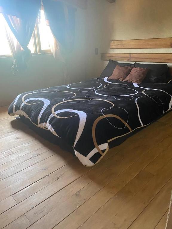 Postel nebo postele na pokoji v ubytování Cabaña Erendy