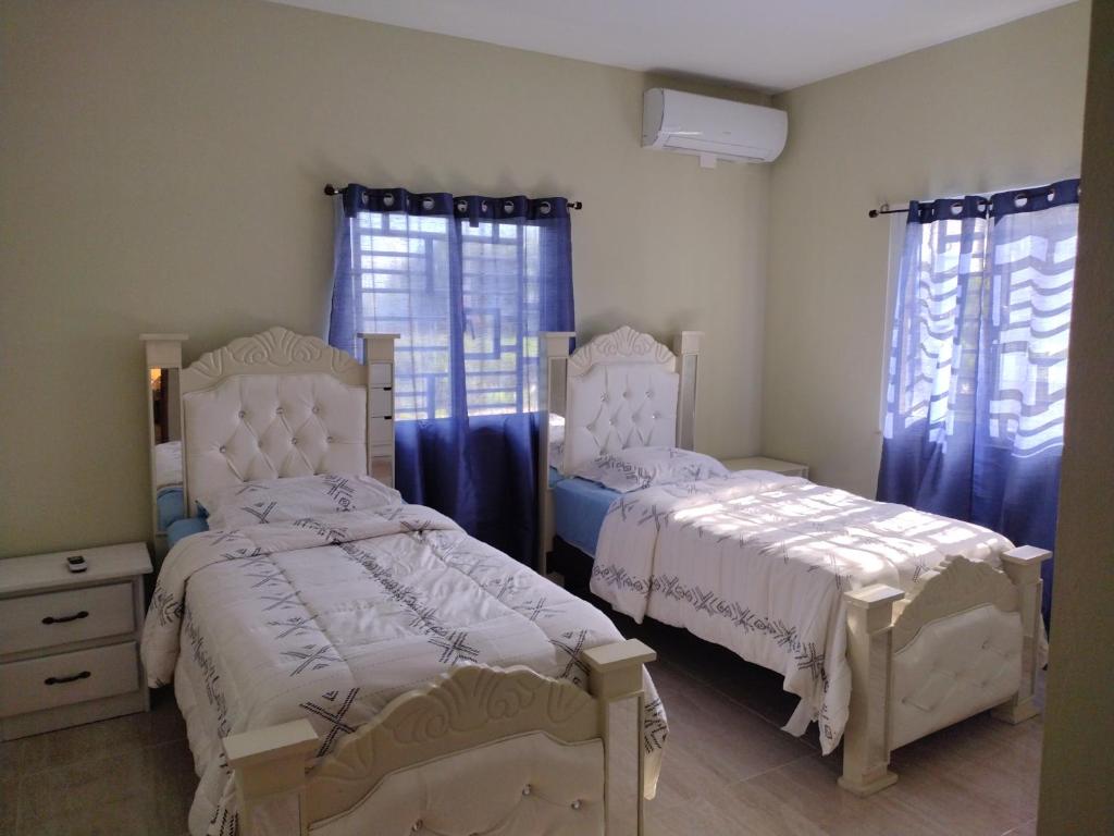 Postel nebo postele na pokoji v ubytování Cabrera Family Villa