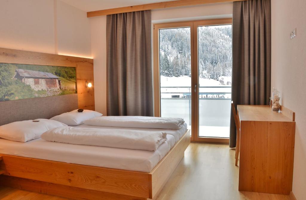 Postel nebo postele na pokoji v ubytování Appartement Schneekristall