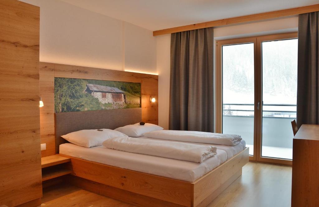 Postel nebo postele na pokoji v ubytování Appartement Schneekristall