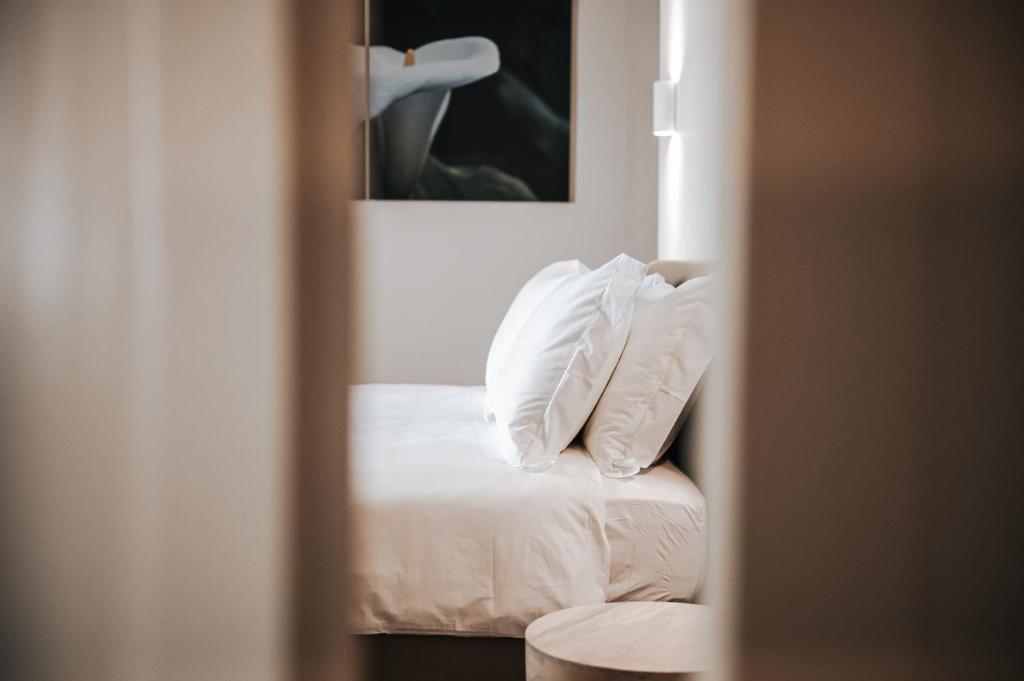 A bed or beds in a room at PALAZZO FRANGIPANE