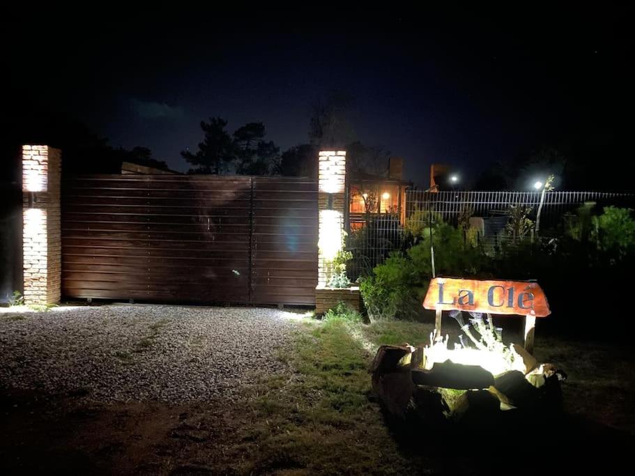 a yard at night with a fence and a sign at Cabaña - La Cle in Ocean Park