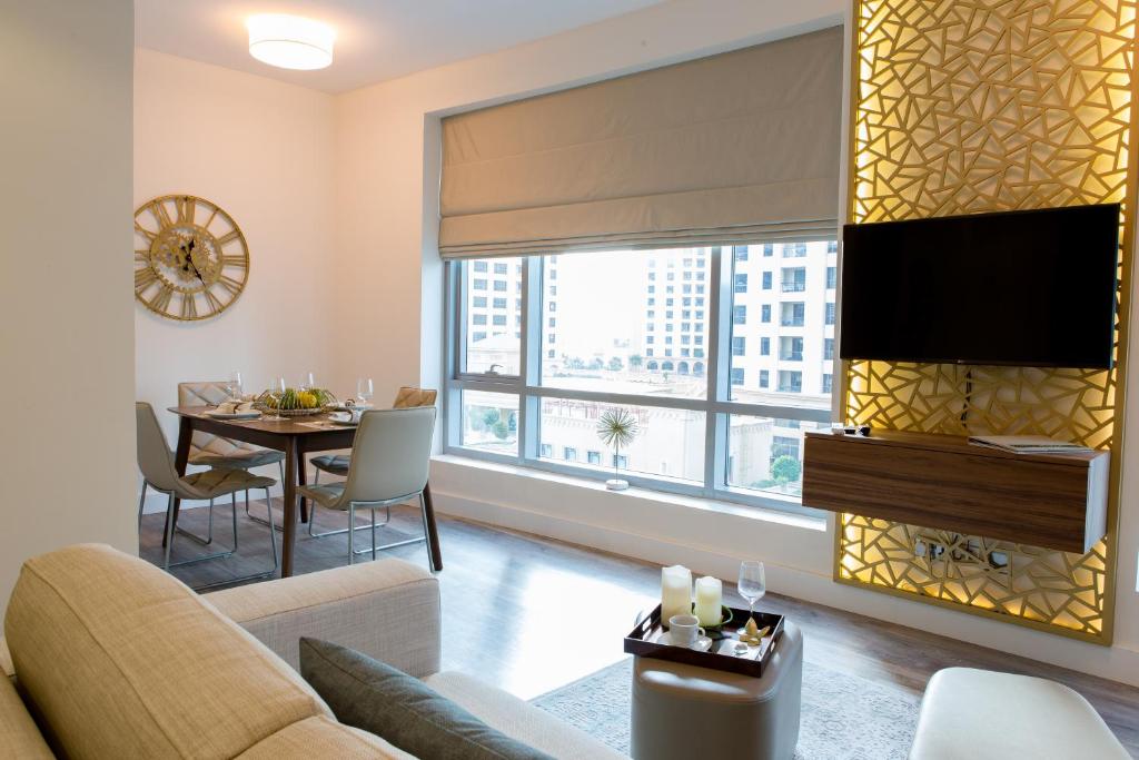 a living room with a couch and a table at Boutique Living - Park Island in Dubai