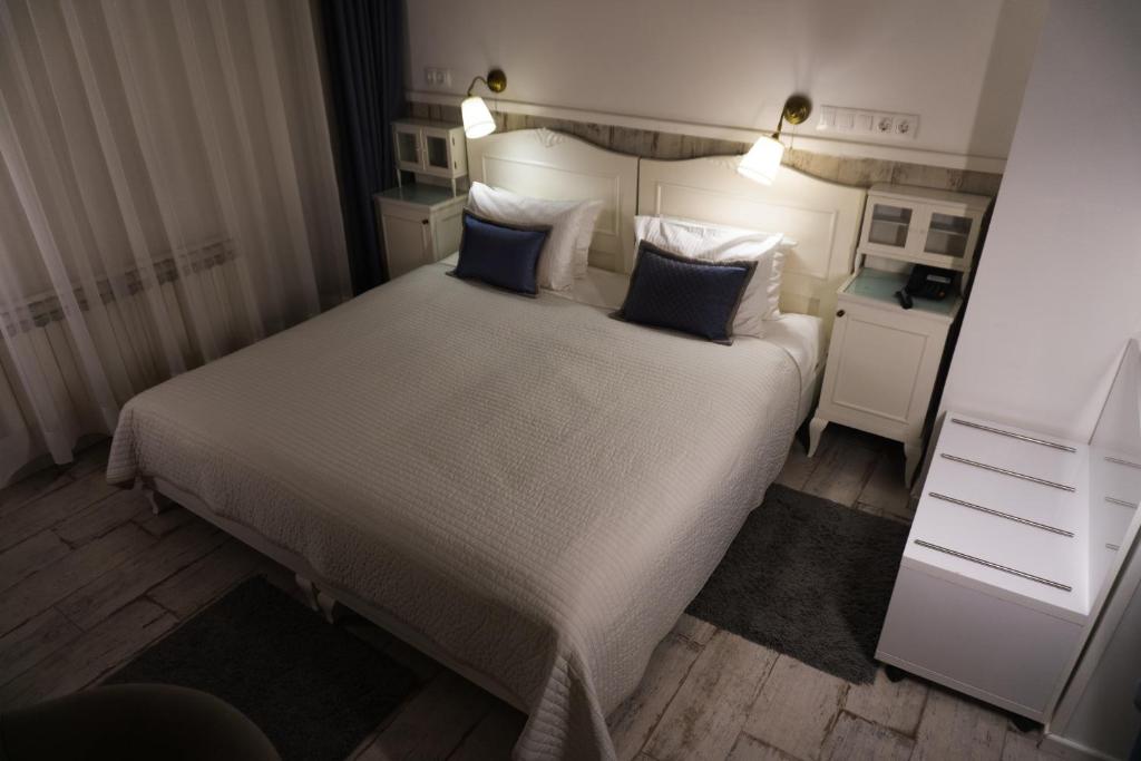 Postel nebo postele na pokoji v ubytování Hotel Divan