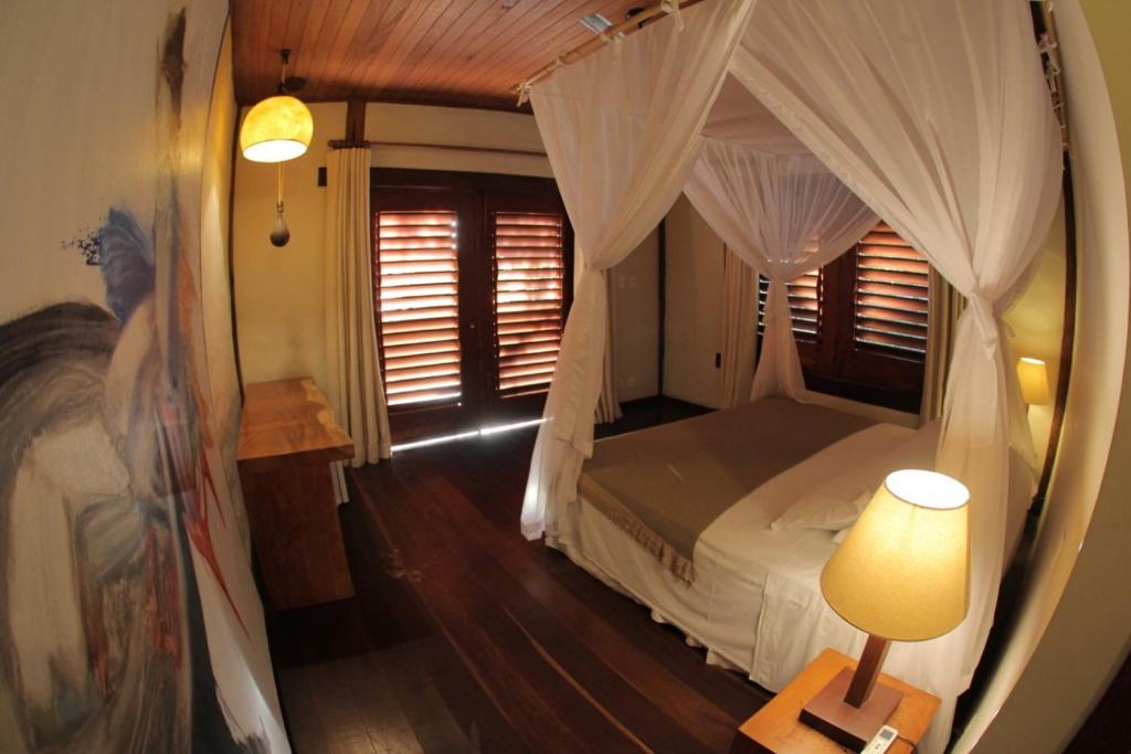 Postel nebo postele na pokoji v ubytování Camauí Hotel