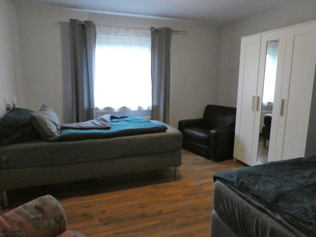 a living room with a couch and a window at Ferienwohnung Wanderparadies Neuwied-Heimbach in Neuwied