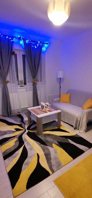 a living room with a zebra patterned rug at Sweet Dreams RD in Travnik