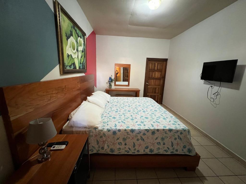 Postel nebo postele na pokoji v ubytování Hotel Viña del Mar Omoa